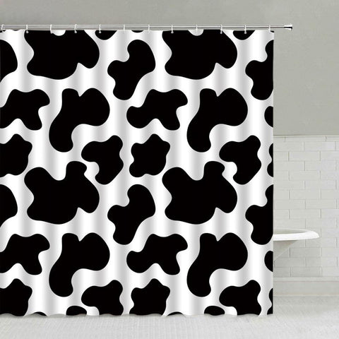 Modern graphic black and white cow print shower curtain