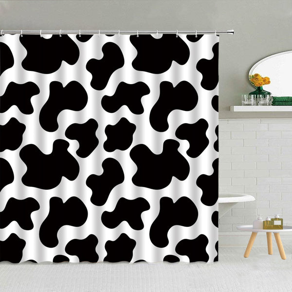 Modern graphic black and white cow print shower curtain
